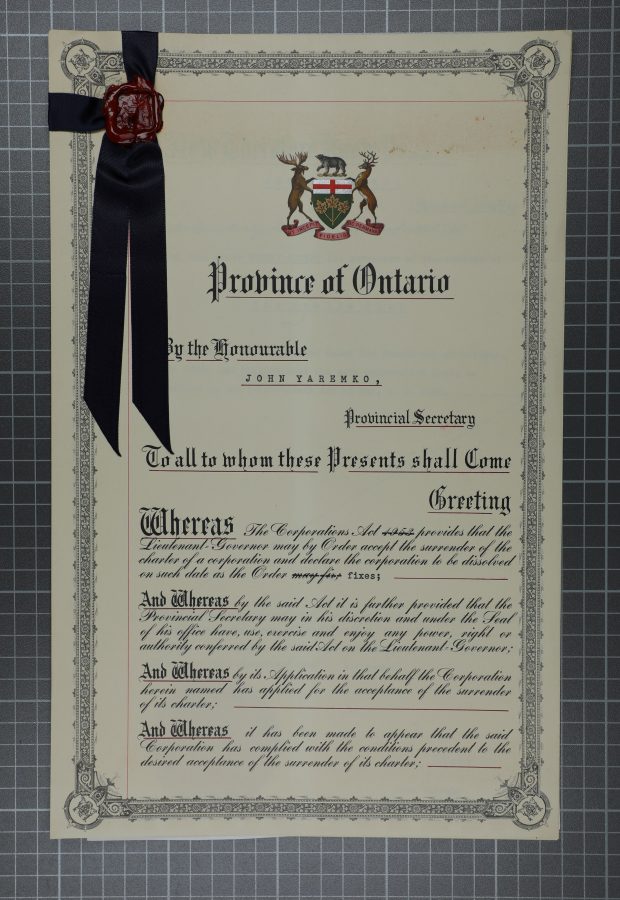 Photograph of original certificate dated April 1961 with a black ribbon and seal on top left corner.