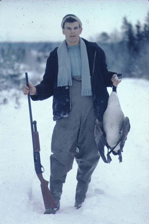 A young man with his hunted goose and gun in Cole Harbour