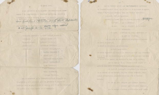 A typed two-page document with a few hand-written notes in blue ink. The document is creased and stained.