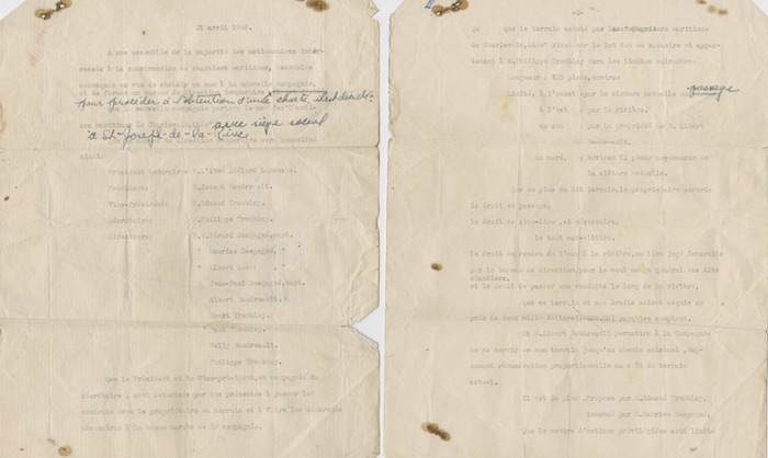 A typed two-page document with a few hand-written notes in blue ink. The document is creased and stained.