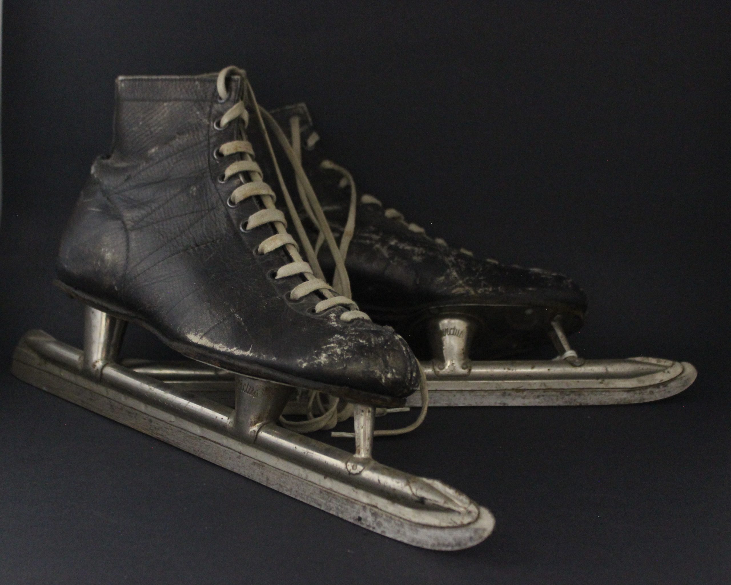 Pair of black men's skates with laces.