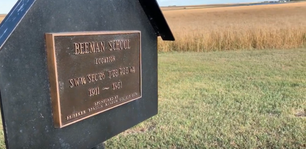 Sign in field marking site of Beeman School, 1911-1951.