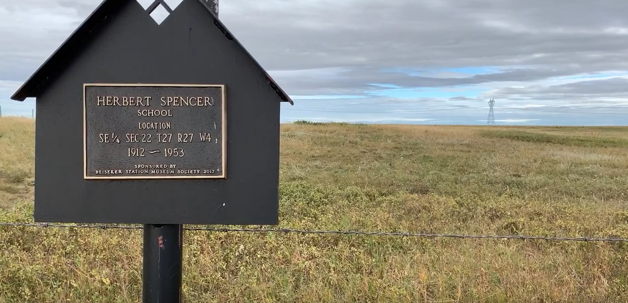 Sign in field marking site of Herbert Spencer School, 1912-1953