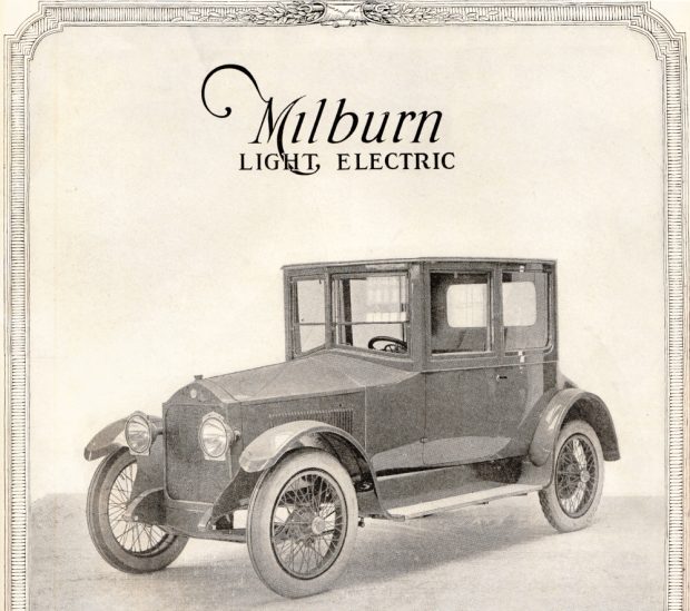 Black and white photograph of a boxy electric car designed to resemble a gasoline automobile. Headline reads Milburn Light Electric