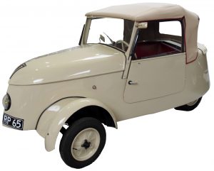 Colour photograph of a tricycle-style convertible vehicle.