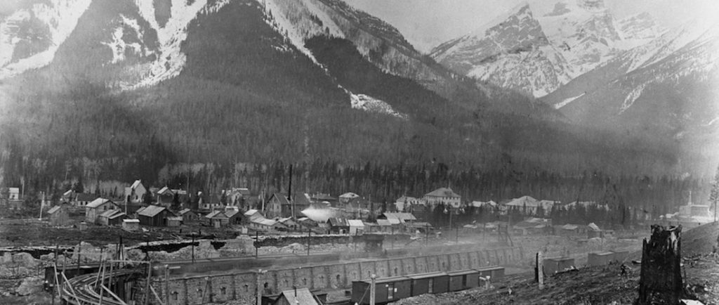 Coke ovens with the townsite of Fernie behind them. Mount Fernie is in the background.