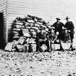 Alberta Provincial Police officers at the Blairmore, Alberta detachment with liquor seized, early 1920s.