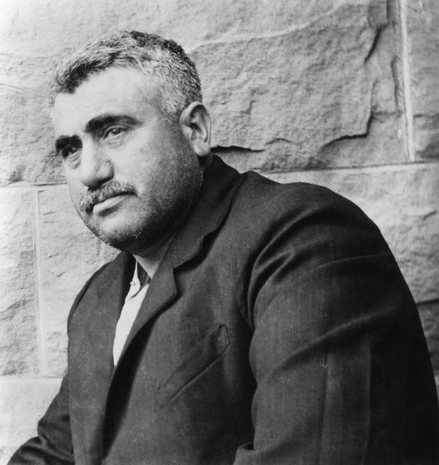 Mug shot of Emilio Picariello taken against a stone wall.