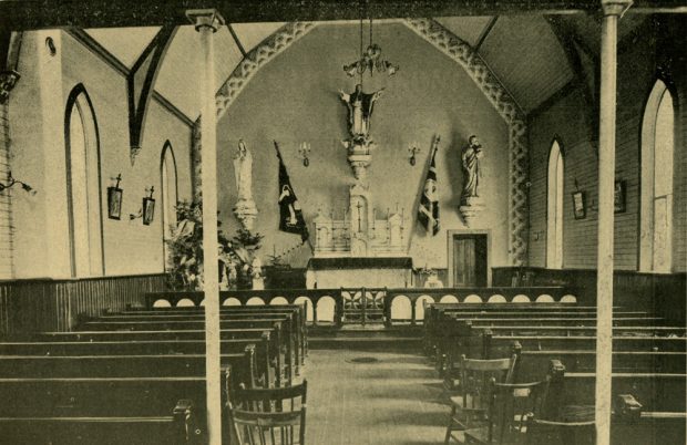 Interior of the Catholic Church. Altar with a shrine at the back.