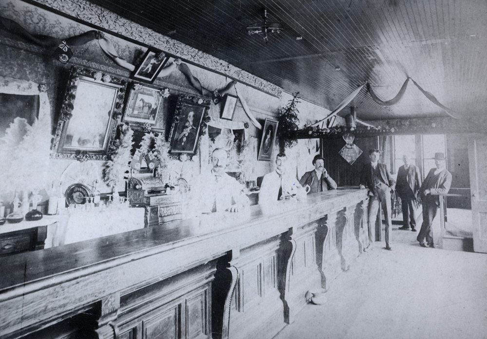 Men standing in a hotel bar.