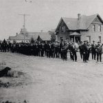 Italian Band parade in front of the funeral parlor on Pellatt Ave, ca 1920.