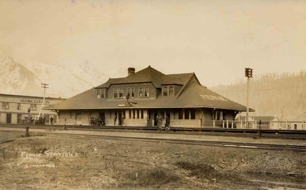 CPR train station with railway tracks in front.