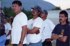 Four off duty firefighters from a Unit Crew wearing t-shirts.