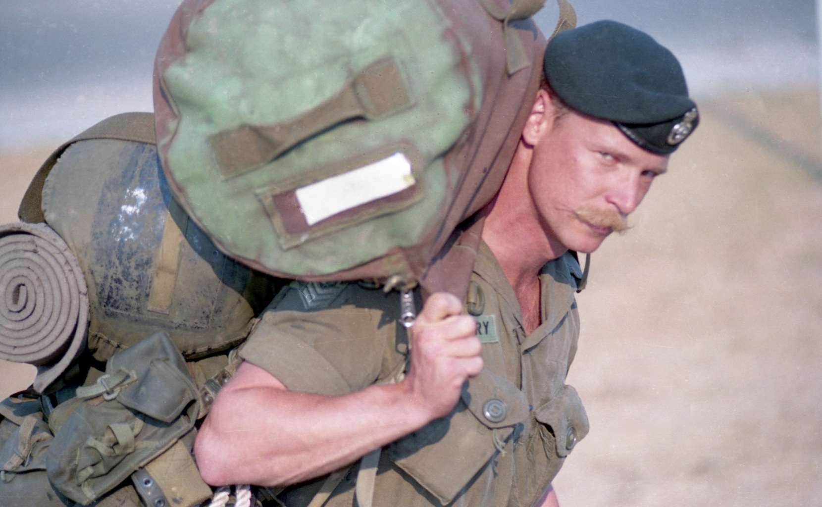 Soldier in uniform carries his personal gear.