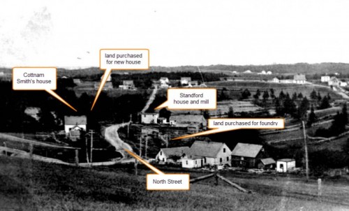 A black and white photo showing the west end of North Street, Chester, with the locations of the foundry land and residence marked. The road runs in the middle of the photo with Cottnman Smith’s house on the left and the Hawboldt house lot further to the east beyond his land. On the right side of the road opposite Smith’s house and running east to the Stanford house is the foundry land and the stream from Stanford Lake.