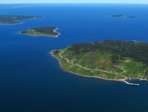 An aerial picture showing Big and Little Tancook Islands surrounded by the waters of Mahone Bay and in the background East Ironbound Island.