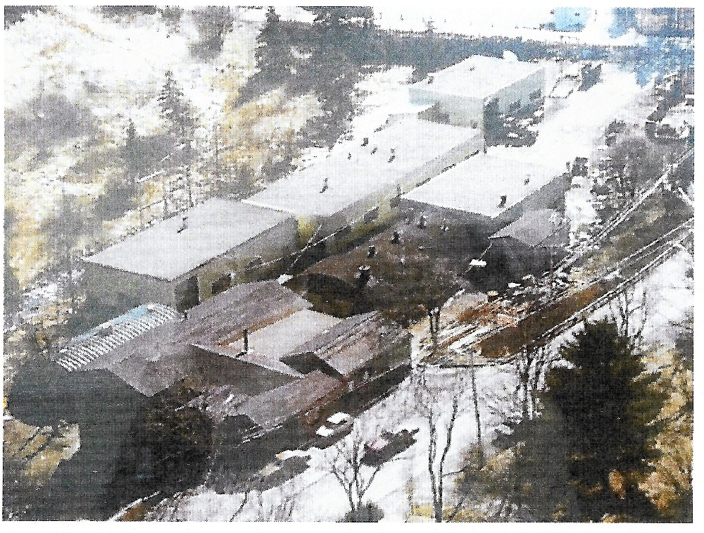 A group of four metal buildings that replaced the old foundry bulding foundry during the 1960s . Surrounding these buildings are four rounded roofed buildings that served as storage and as the foundry and welding areas for the company.