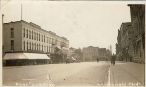 Street view of Kent Street three storey businesses in foreground.