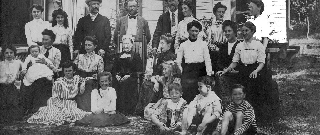 Black and white photo circa 1902 Flavelle family of 24 posing in front of J. R. Dundas’ cottage.