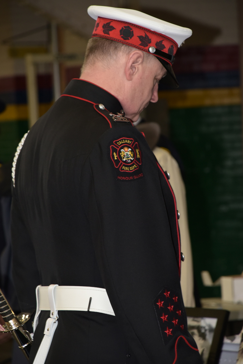 Guardsman Blaine Gray at pre-Memorial ceremony looks downward in a moment of reflection.