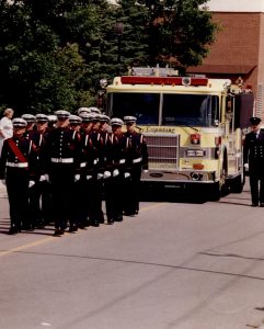 The Honour Guard prepare to march in front of the ceremonial pumper.