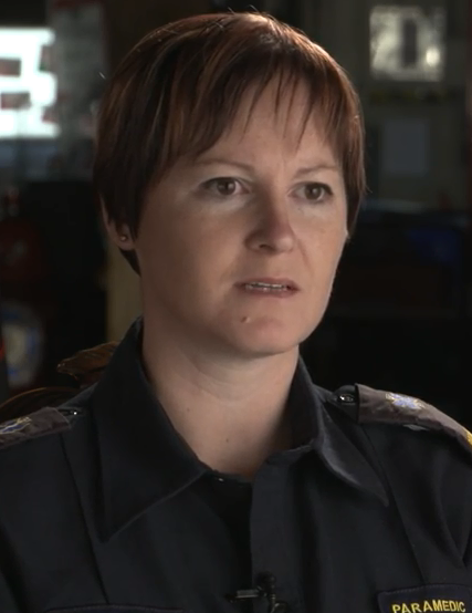 Head and shoulder photo of Jennifer Hall wearing a black shirt with a logo that says Paramedic.