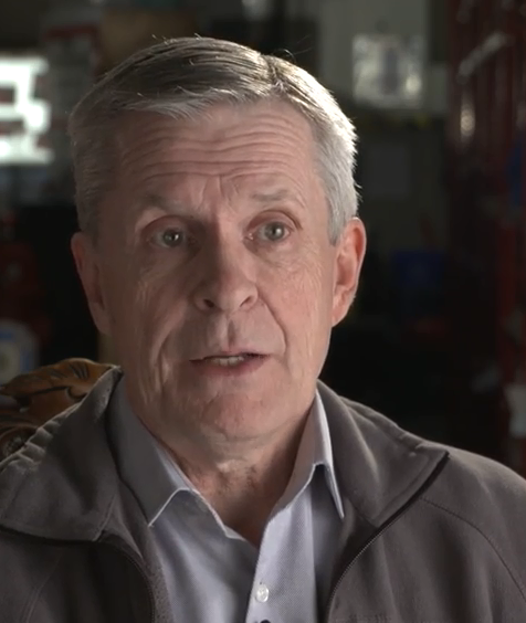 Colour photograph of Rick Choppe wearing a casual shirt and golf jacket.