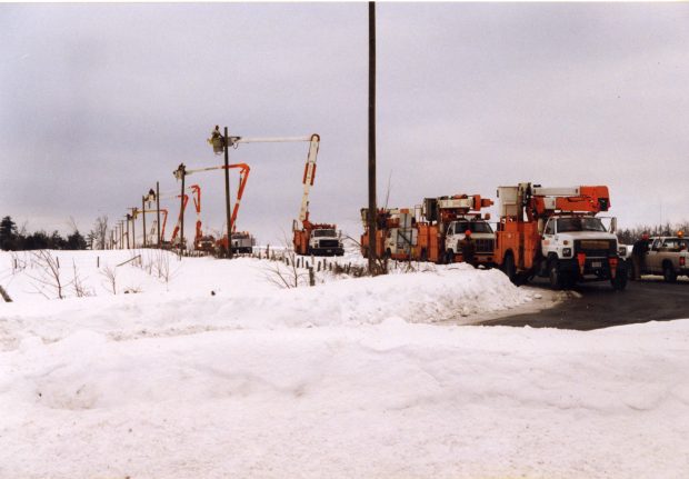 The assembly line electricians working restlessly to bring the current back.