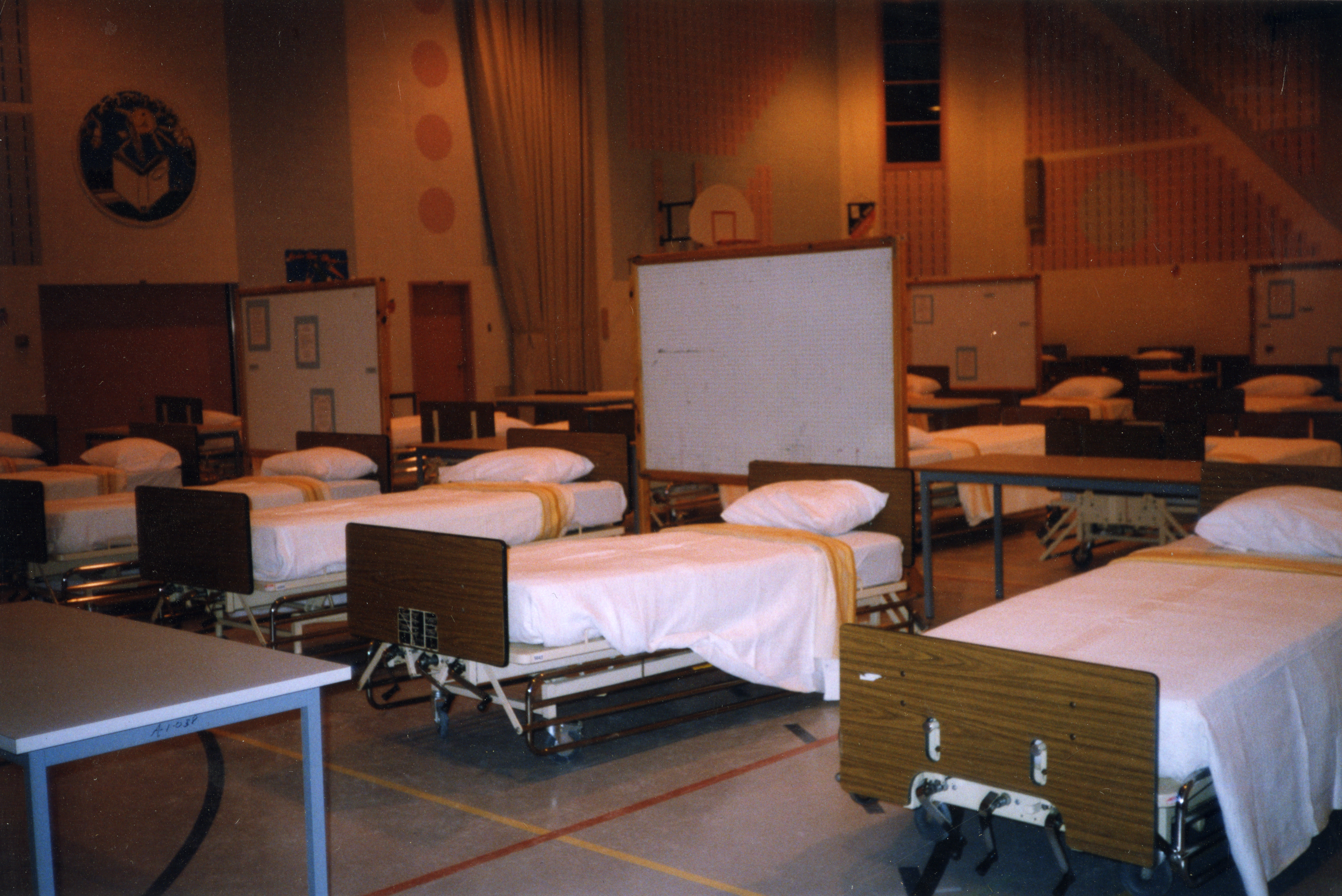 Beds placed in the gymnasium of the school, Des Prés-Verts to host victims of damaged households.