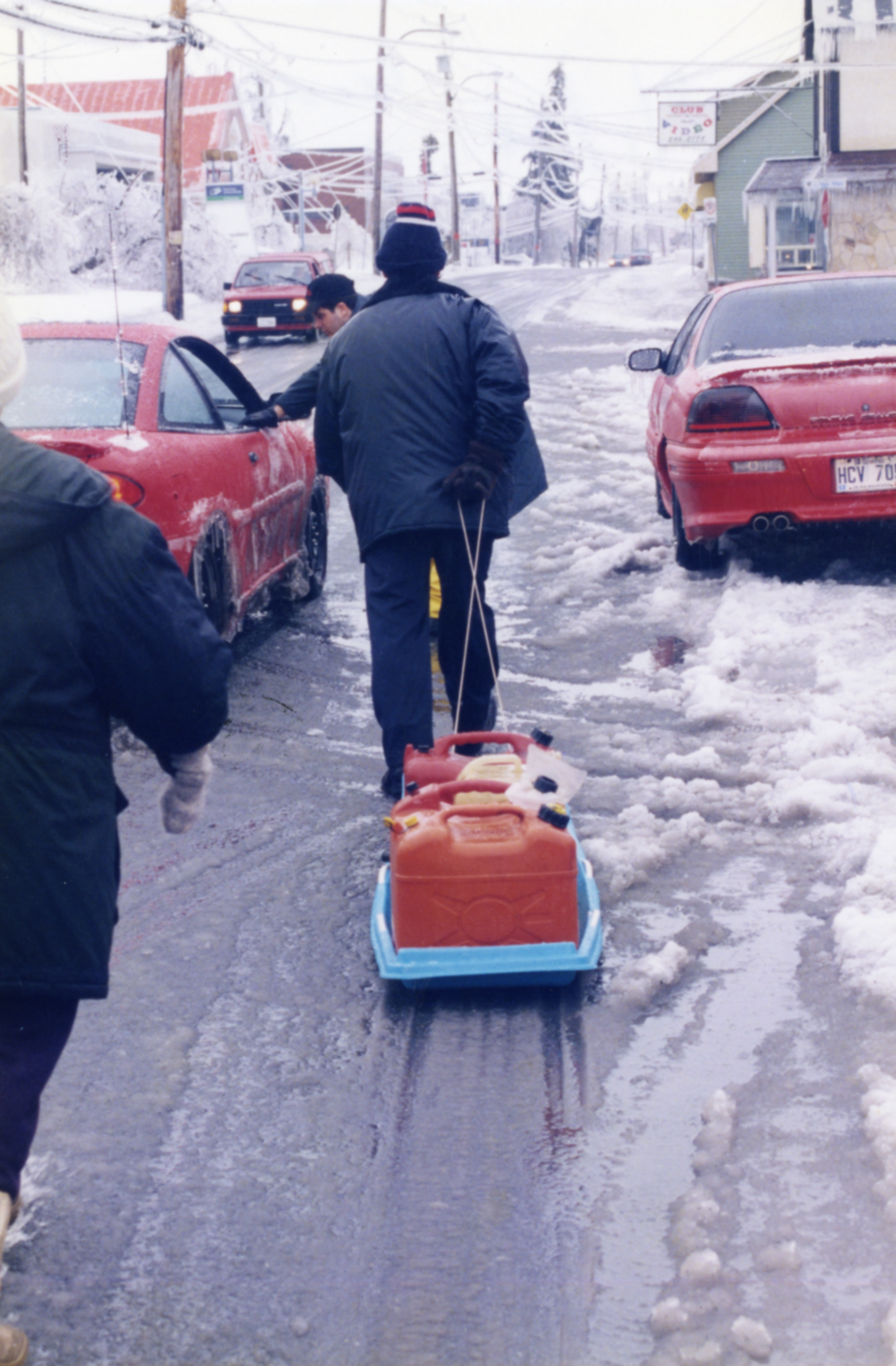 This citizen transported gas tins in a sled, profitting from the icy roads.
