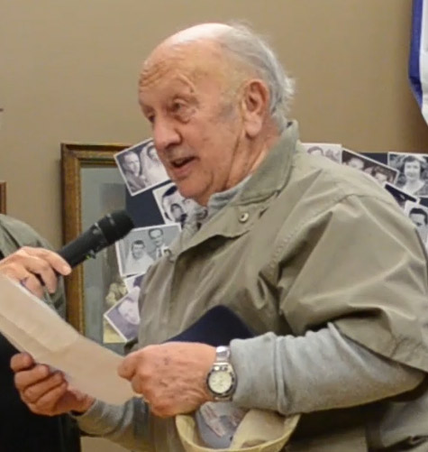 Colour photograph of a man giving a speech