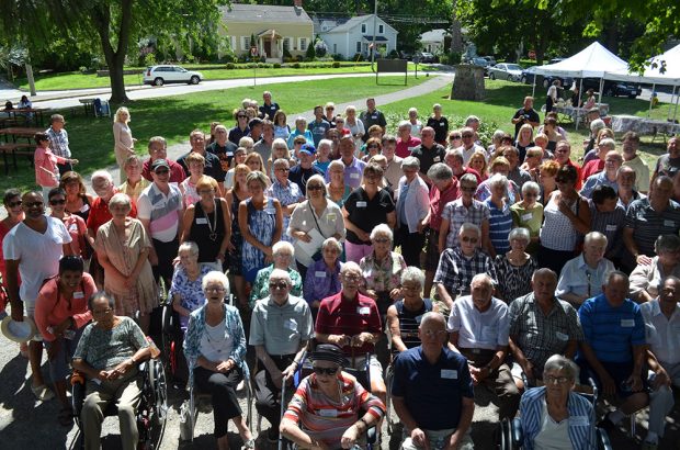 Colour photograph of a group of people at an outdoor event