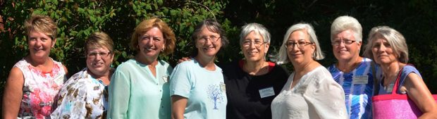 Colour picture with a group of 8 women in a line