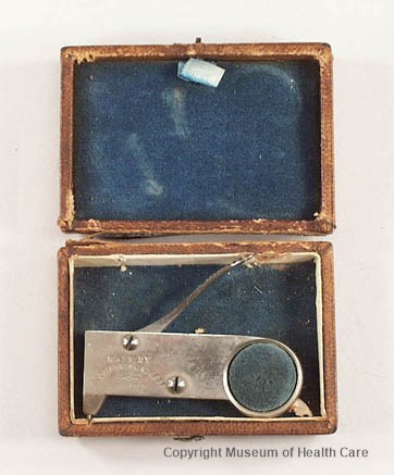 Photograph of an 1860s nickel-plated brass vaccinator in a leather box