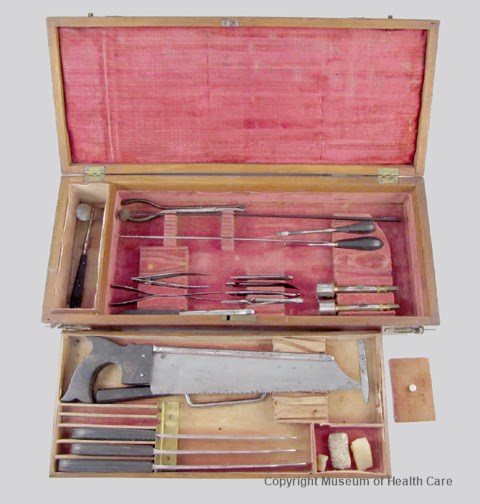 Photograph of Dr. Horatio Yates surgical case containing a bone saw, amputating knives, bullet removal forceps and a variety of blades