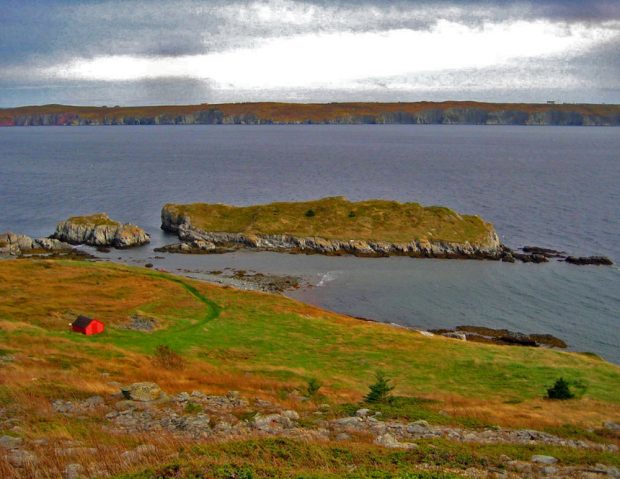 A colour photograph of a coastal scene with two small islands offshore.