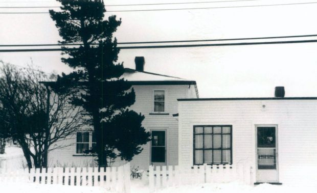 A black and white photograph of two buildings.