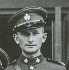 Black-and-white image of man in police uniform