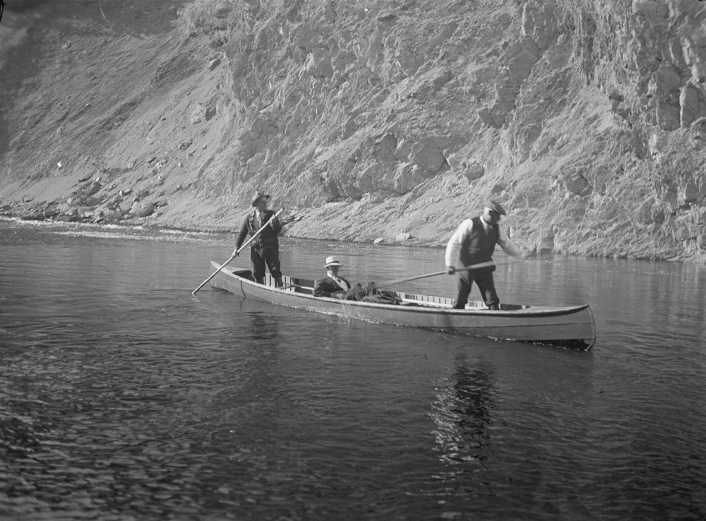 Silver print of Lord Bessborough on the Metis River with two guides.