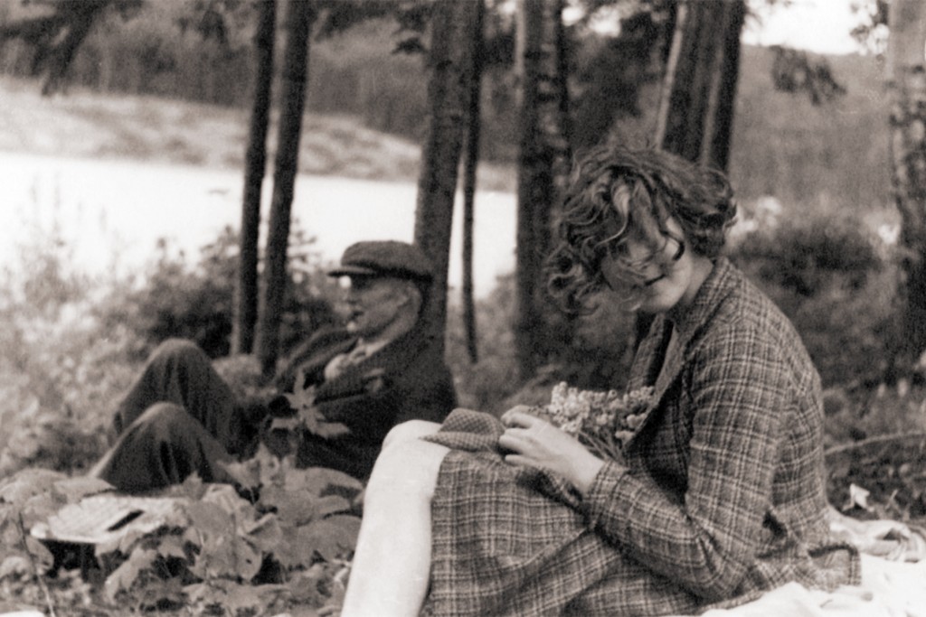 Robert W. Reford and Maryon Reford sitting in the forest along theMetis river