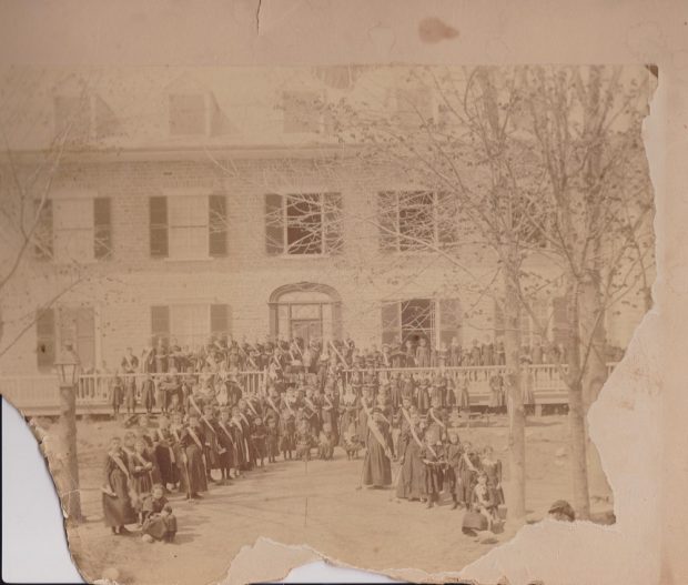 Part of an archival photograph of students and teachers in front of Sainte-Anne’s convent.