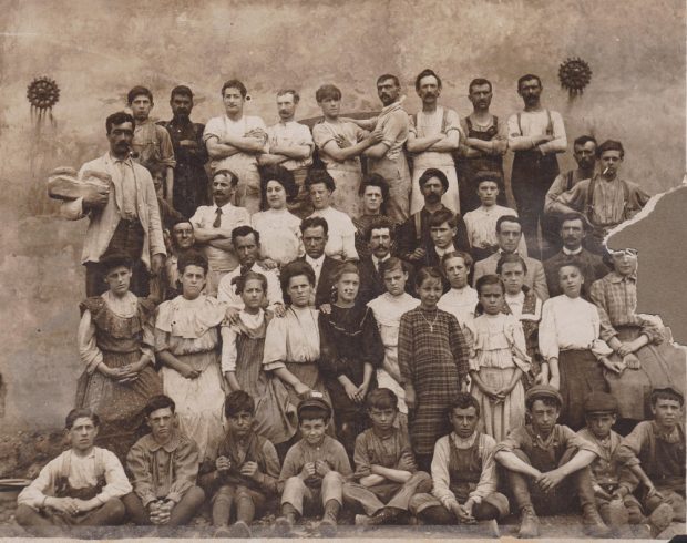 Black and white photograph of about forty men, women and children employed by the Sainte-Anne-de-la-Pérade’s Canadian cookie factory.