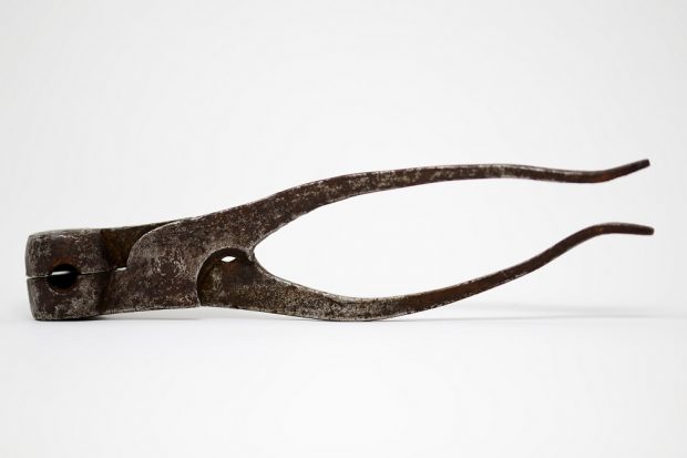 Photograph of a pliers shape round bullet mould in iron and metal.