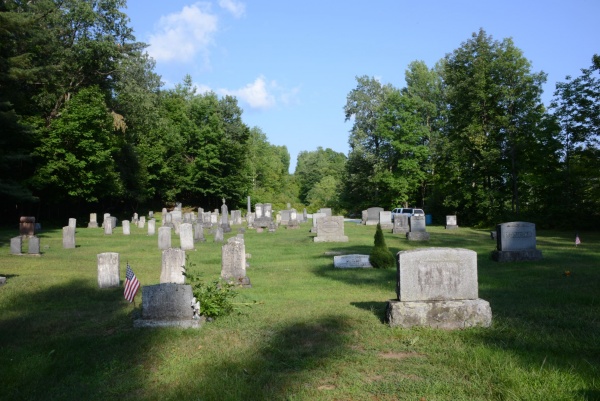 View of a cemetery that crosses the border; some graves are in Canada and others in the United States. Once again, the border isn’t marked. The Boundary Commission considered placing a granite marker of its own among the headstones, but it later decided it was best to let these souls rest in peace in the country where they thought they were buried.