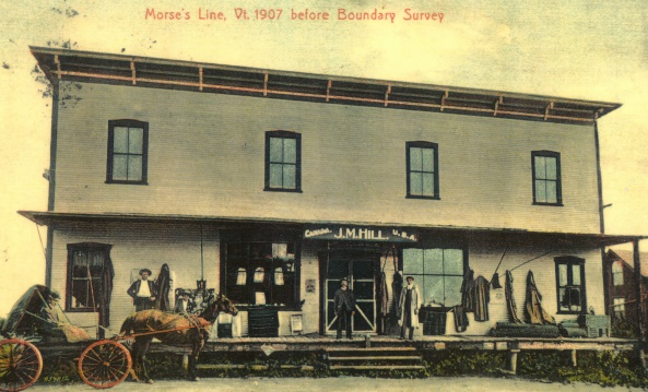 Photo of the J.M. Hill General Store, also a Morse's Line customs post. Above the door, the words Canada and U.S.A. indicate which side of the border you’re standing on.