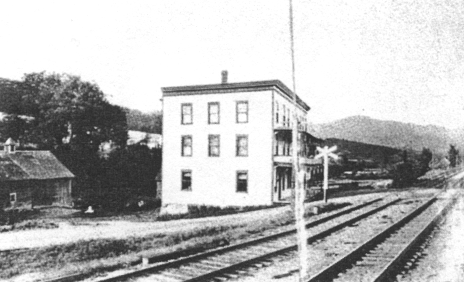 Photo of the three-storey Palace of Sins. The Canadian Pacific Railway tracks ran right in front of the building.