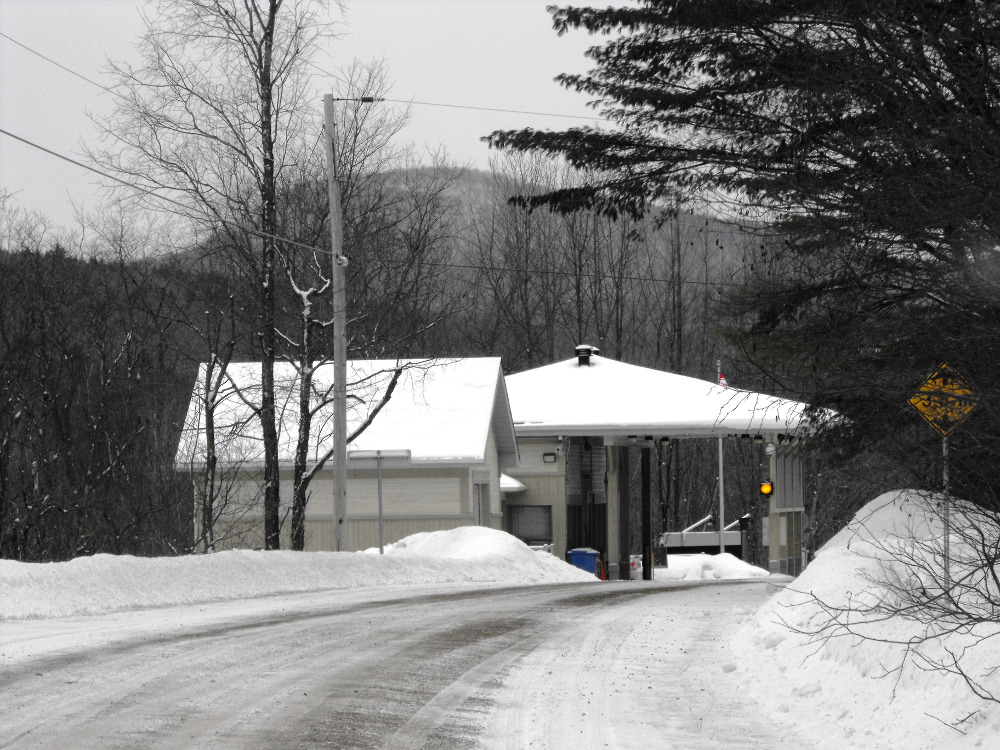 A winter shot of the tiny Canada Customs post at Glen Sutton.