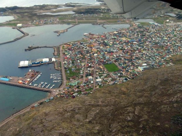 At left are boats at anchor in Saint-Pierre-et-Miquelon’s harbour. On the right, the coastal village founded by this French overseas community.