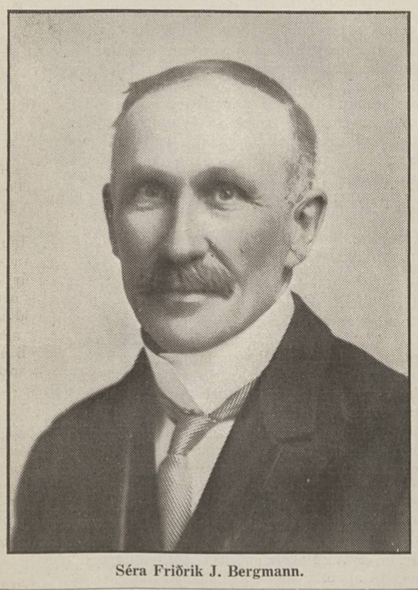 Black-and-white portrait of a man shown from the shoulders up. He has a neatly combed hairstyle, a trimmed mustache, and wears a formal jacket with a high-collared shirt and tie. His name, Séra Friðrik J. Bergmann, is printed below the image.