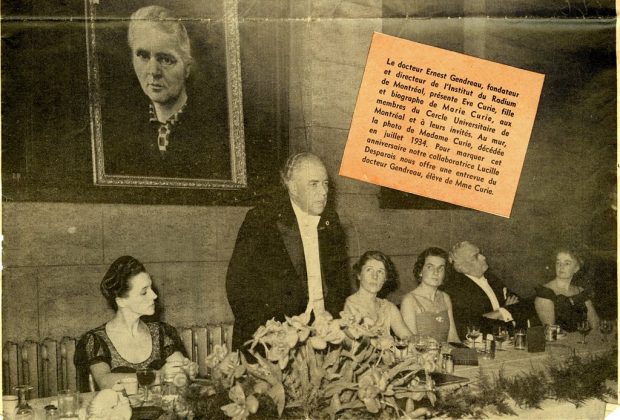Black and white image of Dr. Ernest Gendreau wearing a black tuxedo with white shirt and bow tie, giving a speech at a reception in Montreal; four women and one man are seated at his table. Behind him a portrait of Marie Curie hangs on the wall. A clipping of text to the right explains the scene.